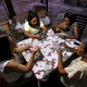 Women play a Russian poker card game in Angeles city, north of Manila.